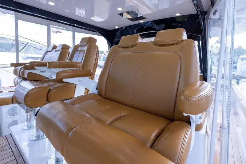 Next To Sell Yacht Photos Pics Luxurious leather seating inside 2020 HCB 65 Estrella yacht, showcasing comfort and elegance.