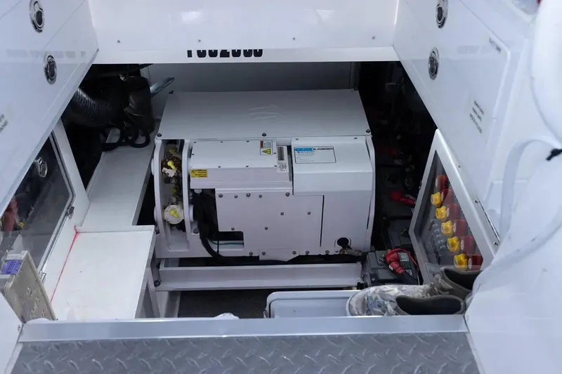 Next To Sell Yacht Photos Pics Engine compartment of a 2020 HCB Estrella boat, showcasing machinery and storage.