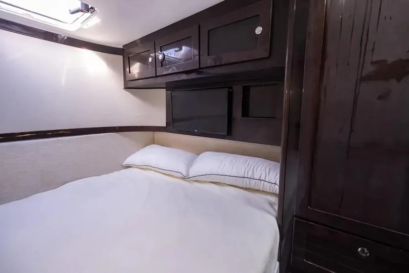 Next To Sell Yacht Photos Pics Luxurious cabin interior of 2020 HCB Estrella yacht with cozy bed and storage.