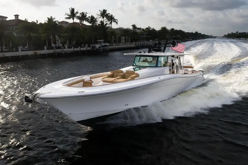 Next To Sell Yacht Photos Pics 2020 HCB Estrella boat cruising on a scenic waterway with palm trees.