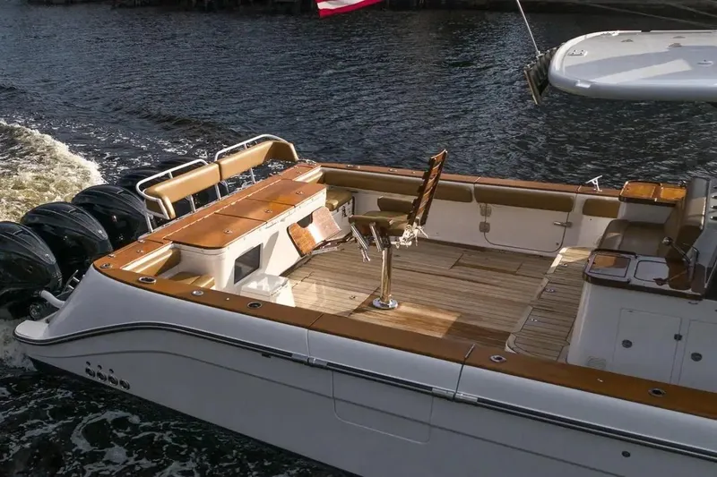 Next To Sell Yacht Photos Pics 2020 HCB Estrella boat with luxurious deck and multiple outboard engines on water.