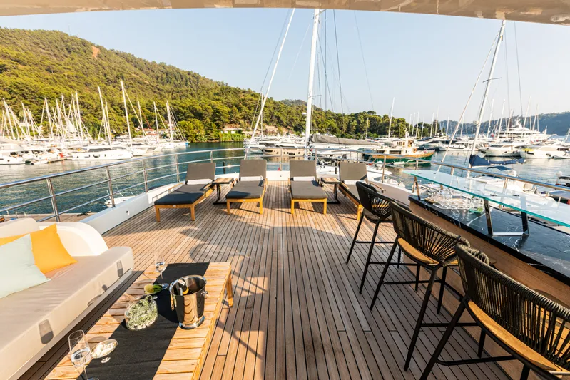 Zeemar Yacht Photos Pics Luxurious deck of 2016 Custom Aydos Yat Sanayi 100' yacht in a scenic marina.