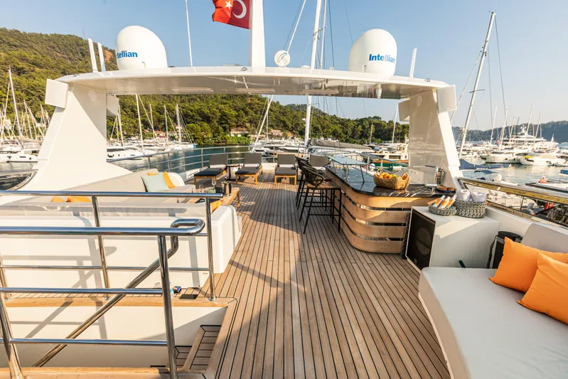 Zeemar Yacht Photos Pics Luxurious 2016 Custom Aydos Yat Sanayi 100' yacht deck with seating and bar area.
