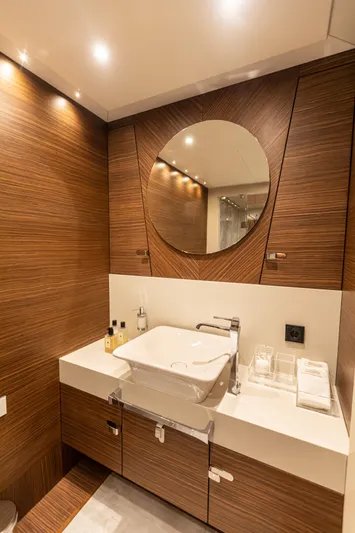 Zeemar Yacht Photos Pics Modern bathroom on 2016 Custom Aydos Yat Sanayi 100' yacht with wood paneling and round mirror.