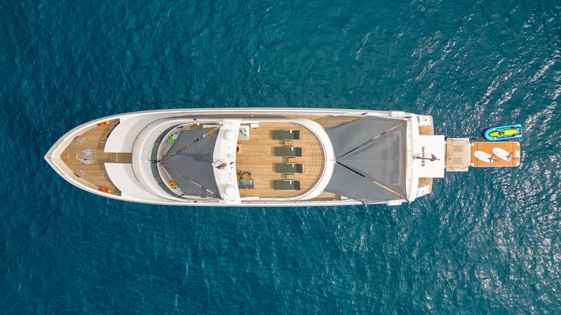 Zeemar Yacht Photos Pics Aerial view of 2016 Custom Aydos Yat Sanayi 100' yacht on blue ocean.