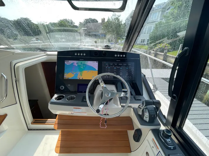 Sea Cure Yacht Photos Pics Helm of 2021 Boston Whaler 405 Conquest with navigation display and controls.