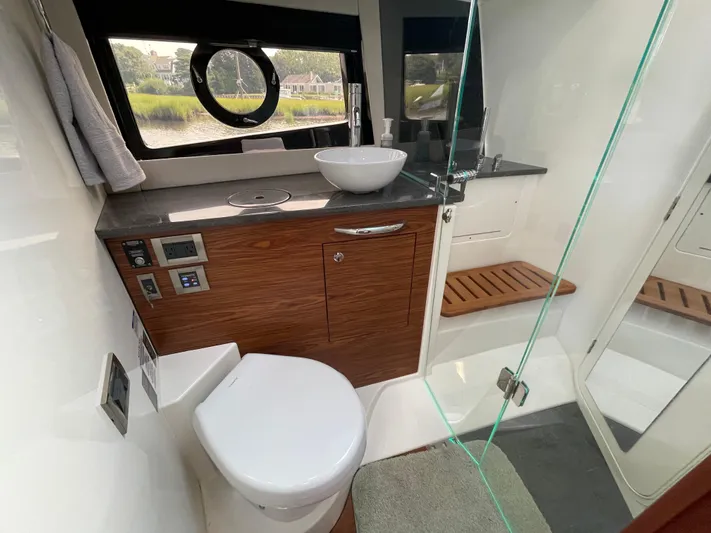 Sea Cure Yacht Photos Pics Luxurious bathroom interior of 2021 Boston Whaler 405 Conquest yacht with modern amenities.