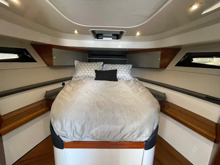 Sea Cure Yacht Photos Pics Luxurious cabin interior of 2021 Boston Whaler 405 Conquest with cozy bedding.