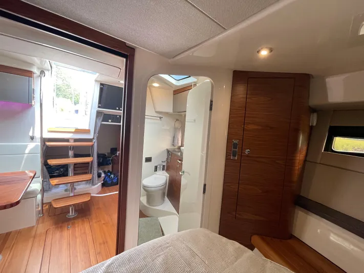Sea Cure Yacht Photos Pics Interior of 2021 Boston Whaler 405 Conquest, featuring modern wood finishes and compact bathroom.