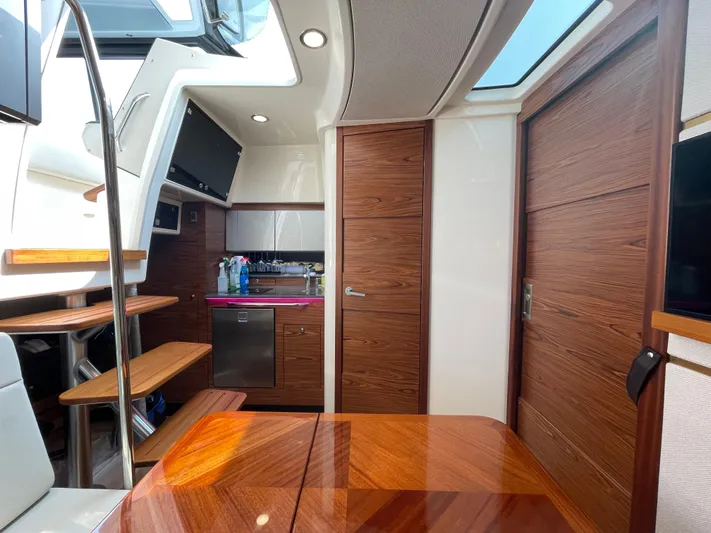 Sea Cure Yacht Photos Pics Interior of 2021 Boston Whaler 405 Conquest, featuring wood finishes and modern amenities.