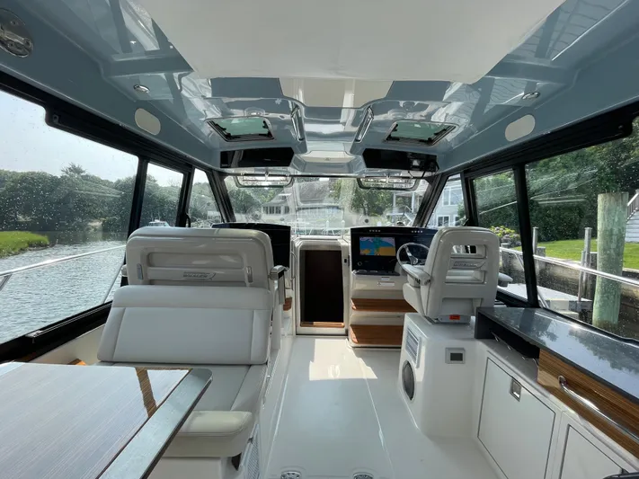 Sea Cure Yacht Photos Pics Interior of 2021 Boston Whaler 405 Conquest boat, featuring modern helm and seating.