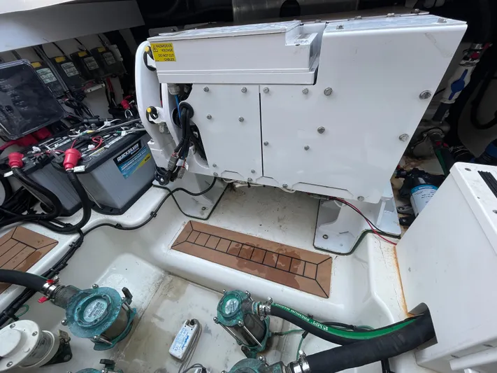 Sea Cure Yacht Photos Pics Engine compartment of a 2021 Boston Whaler 405 Conquest with visible wiring and components.