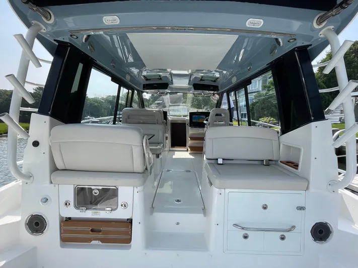 Sea Cure Yacht Photos Pics Interior view of 2021 Boston Whaler 405 Conquest boat, featuring spacious seating and modern design.