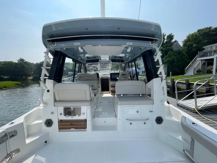 Sea Cure Yacht Photos Pics 2021 Boston Whaler 405 Conquest boat interior, featuring spacious seating and modern design.