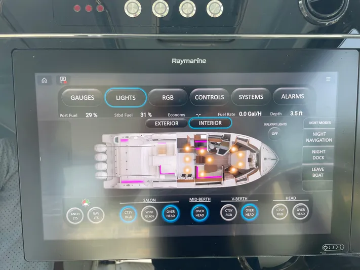 Sea Cure Yacht Photos Pics Touchscreen control panel on a 2021 Boston Whaler 405 Conquest boat, displaying interior settings.