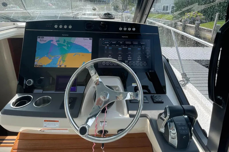 Sea Cure Yacht Photos Pics Helm of 2021 Boston Whaler 405 Conquest with advanced navigation displays and controls.