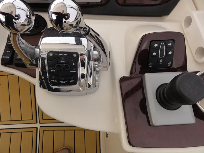  Yacht Photos Pics Control panel of a 2009 Meridian 441 Sedan yacht with throttle and joystick.