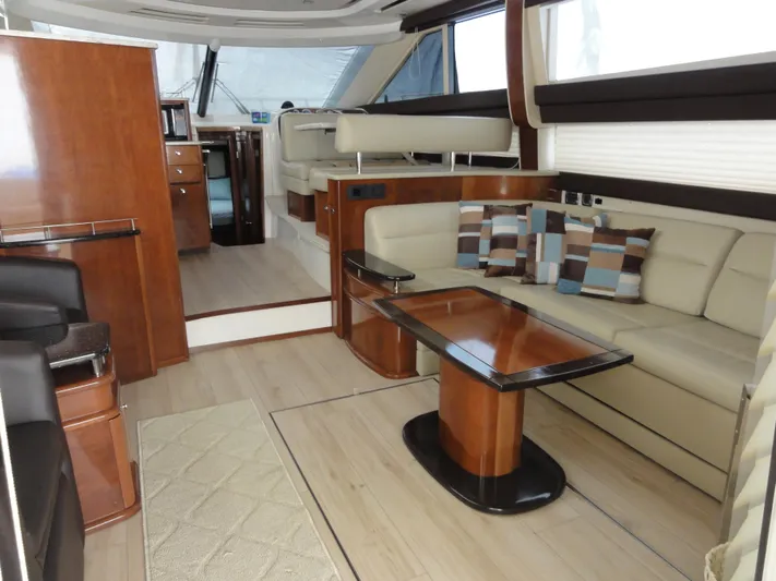  Yacht Photos Pics Luxurious interior of 2009 Meridian 441 Sedan yacht with elegant seating and wooden finishes.
