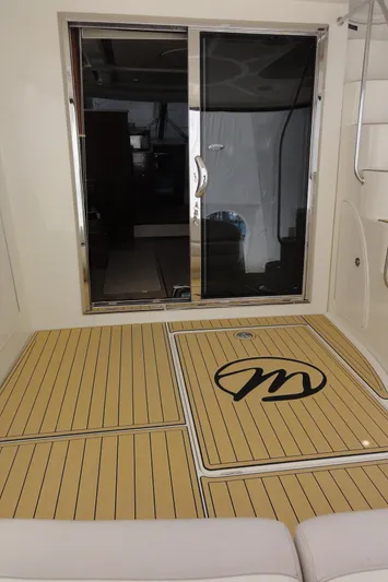  Yacht Photos Pics 2009 Meridian 441 Sedan yacht deck with sliding glass door and logo.