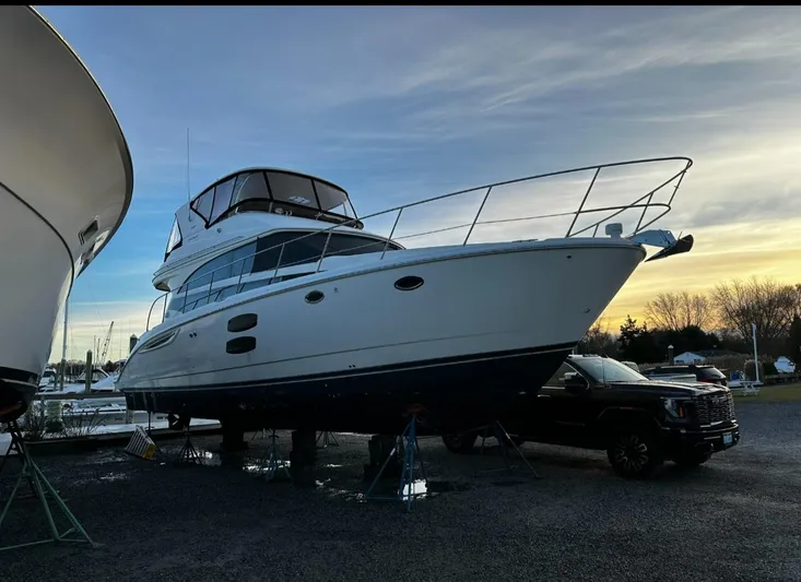 Yacht Photos Pics 2009 Meridian 441 Sedan yacht on stands at sunset, side view.