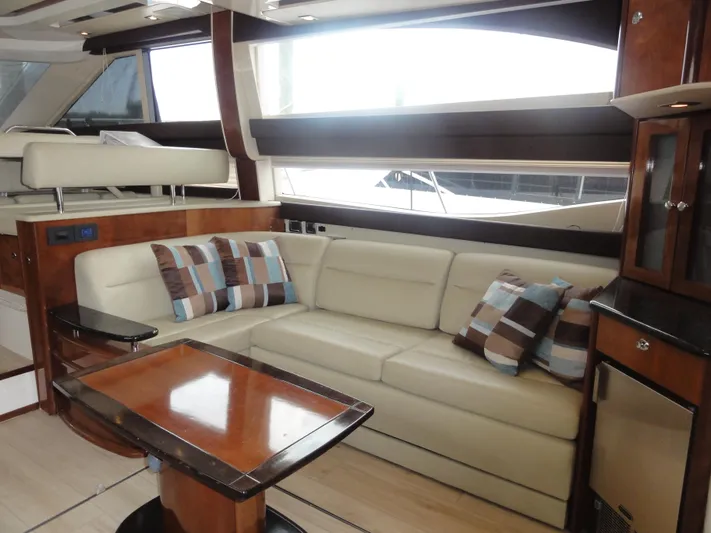  Yacht Photos Pics Luxurious interior of 2009 Meridian 441 Sedan yacht with plush seating and elegant wood finishes.
