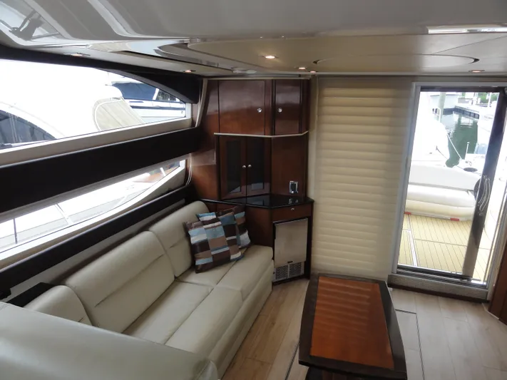  Yacht Photos Pics Luxurious interior of 2009 Meridian 441 Sedan yacht with leather seating and modern decor.