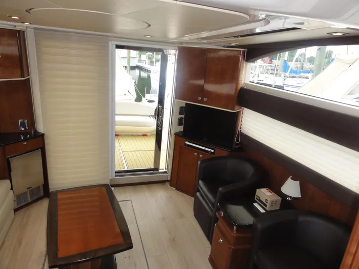  Yacht Photos Pics Luxurious interior of 2009 Meridian 441 Sedan yacht with modern furnishings and wood accents.