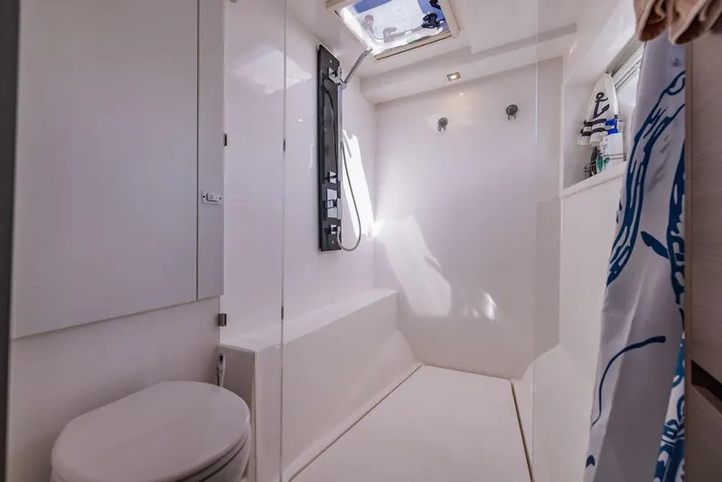 Nautilus Yacht Photos Pics Modern bathroom interior on 2021 Leopard 53 Powercat yacht, featuring shower and toilet.