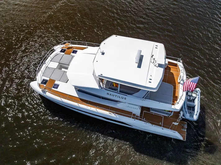 Nautilus Yacht Photos Pics 2021 Leopard 53 Powercat yacht on water, aerial view, with American flag.