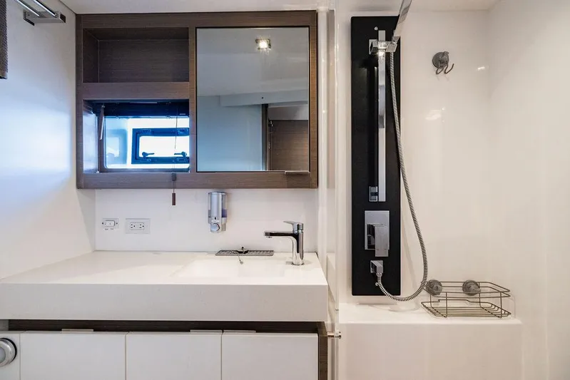 Nautilus Yacht Photos Pics Modern bathroom interior of 2021 Leopard 53 Powercat yacht with sleek fixtures and shower.