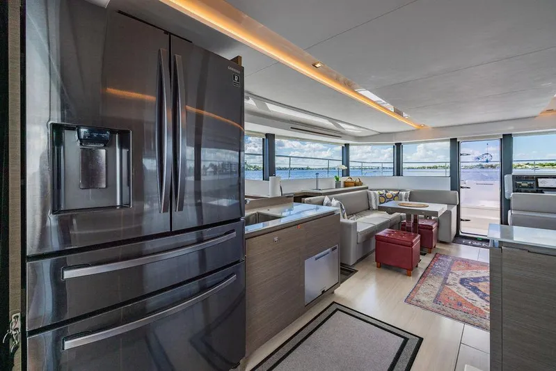 Nautilus Yacht Photos Pics Luxurious interior of 2021 Leopard 53 Powercat yacht with modern kitchen and spacious seating area.