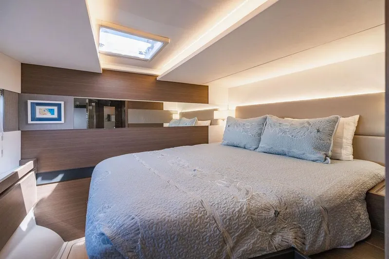 Nautilus Yacht Photos Pics Luxurious bedroom interior of 2021 Leopard 53 Powercat yacht with modern design and skylight.