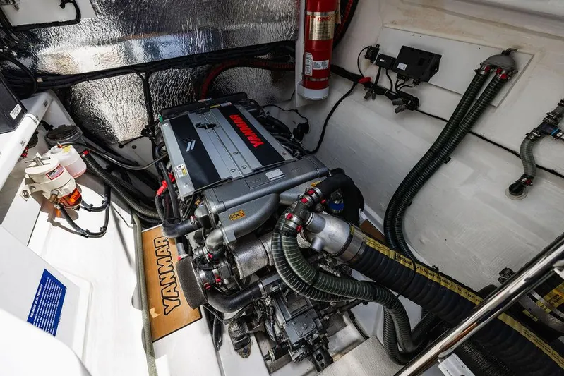 Nautilus Yacht Photos Pics Engine room of 2021 Leopard 53 Powercat with Yanmar engine and fire extinguisher.