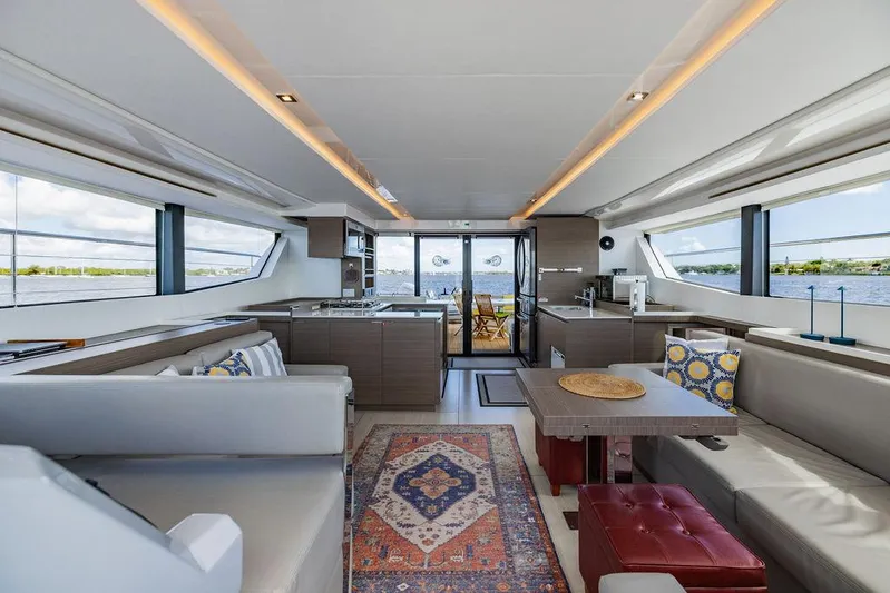 Nautilus Yacht Photos Pics Luxurious interior of 2021 Leopard 53 Powercat yacht with modern furnishings and panoramic windows.