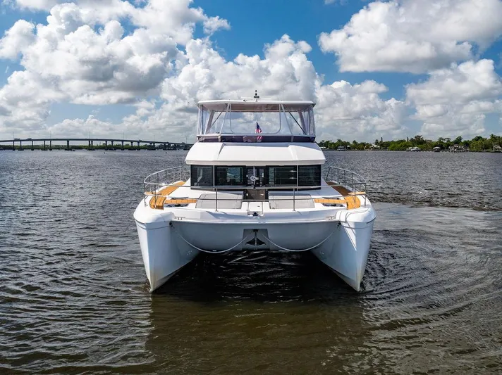Nautilus Yacht Photos Pics 2021 Leopard 53 Powercat on water under cloudy sky.