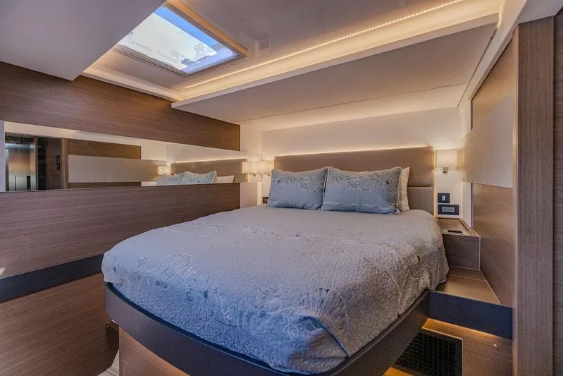 Nautilus Yacht Photos Pics Luxurious bedroom interior of 2021 Leopard 53 Powercat with skylight and modern design.
