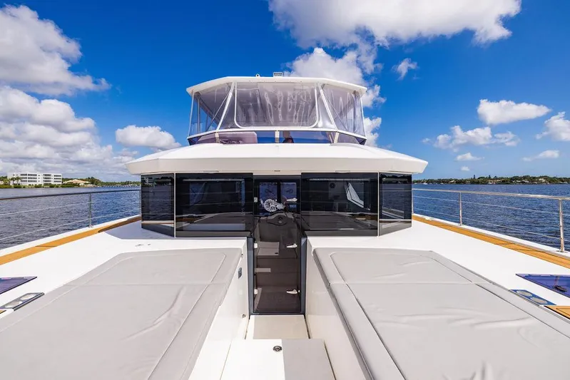 Nautilus Yacht Photos Pics 2021 Leopard 53 Powercat yacht on water, featuring spacious deck and modern design.