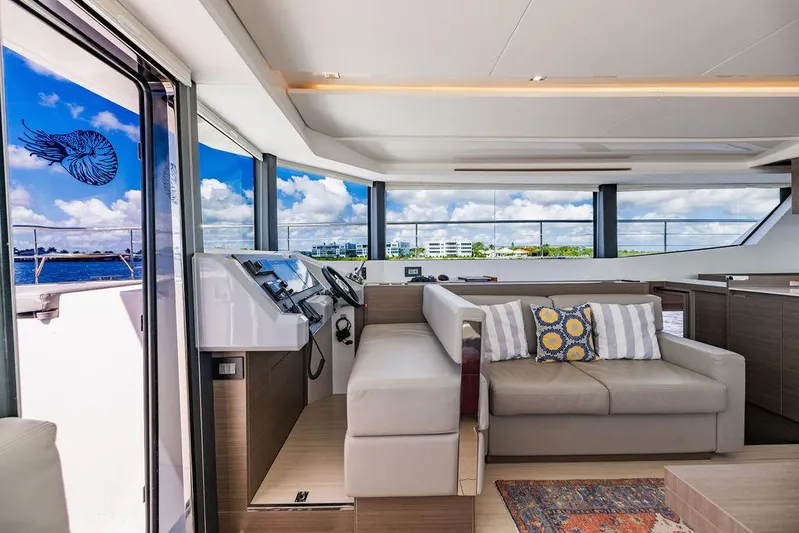 Nautilus Yacht Photos Pics Luxurious interior of 2021 Leopard 53 Powercat yacht with modern seating and panoramic views.