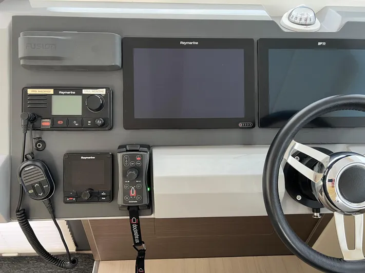 Nautilus Yacht Photos Pics Control panel of a 2021 Leopard 53 Powercat with navigation and communication equipment.