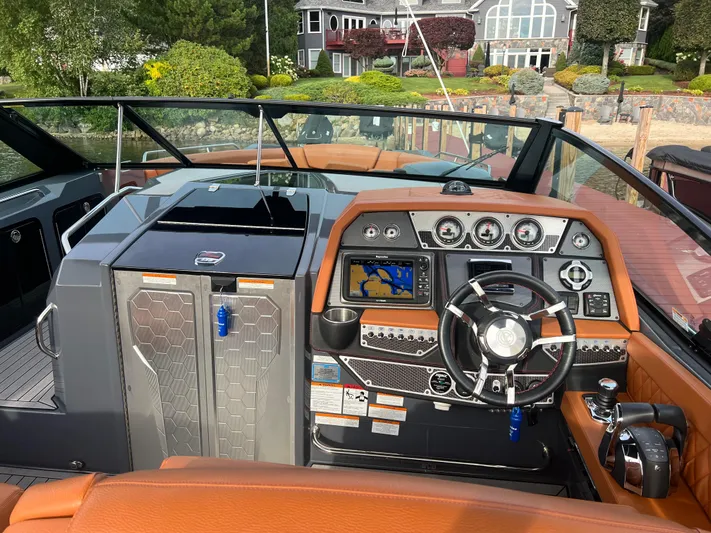  Yacht Photos Pics 2016 Cruisers Yachts 338 SOUTH BEACH helm with modern controls and navigation system.