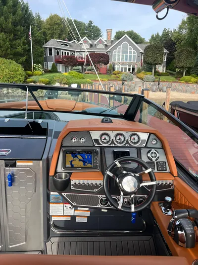  Yacht Photos Pics 2016 Cruisers Yachts 338 SOUTH BEACH dashboard with navigation system, steering wheel, and luxurious interior.