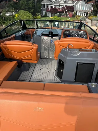  Yacht Photos Pics 2016 Cruisers Yachts 338 SOUTH BEACH interior with orange seating and modern dashboard.