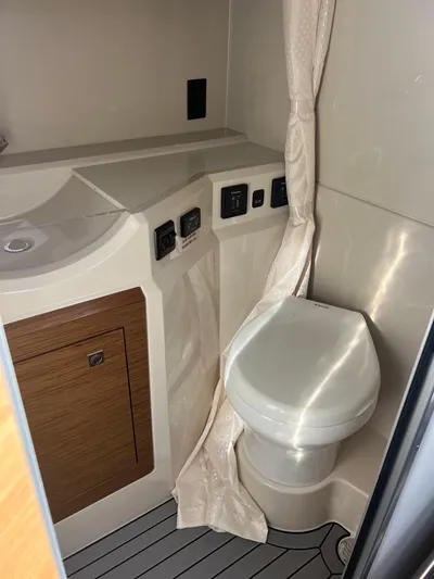 Yacht Photos Pics 2016 Cruisers Yachts 338 SOUTH BEACH bathroom with toilet and sink.
