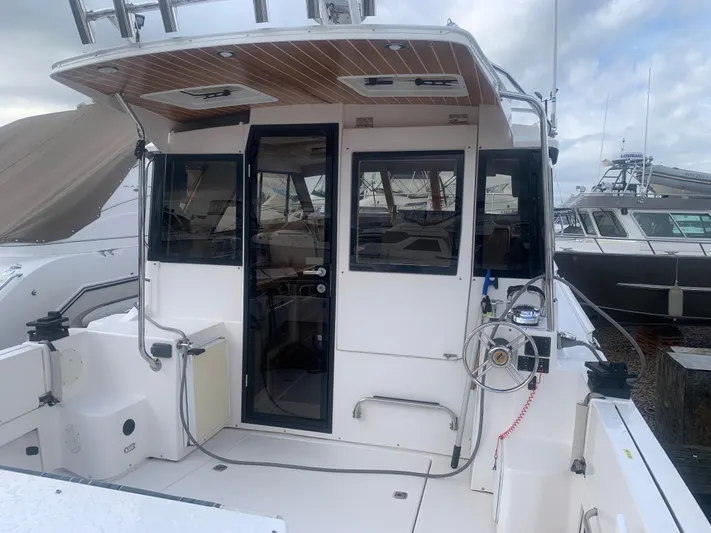  Yacht Photos Pics 2018 Cutwater C 302 Coupe boat docked at marina, rear view.