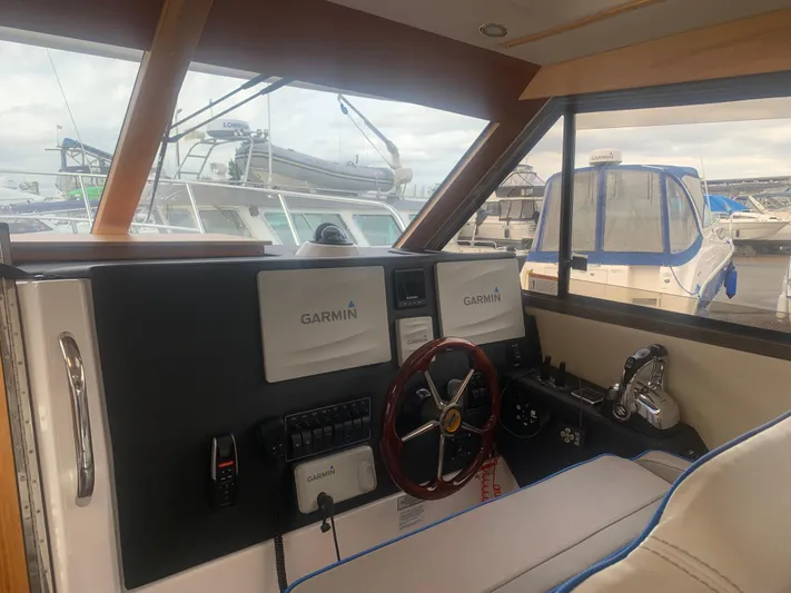  Yacht Photos Pics 2018 Cutwater C 302 Coupe helm with Garmin navigation system.