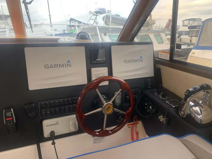  Yacht Photos Pics 2018 Cutwater C 302 Coupe helm with Garmin navigation system.