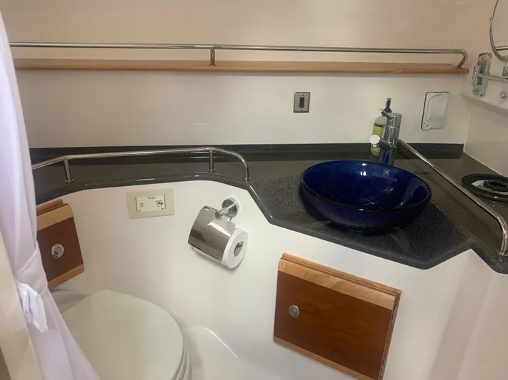 Yacht Photos Pics 2018 Cutwater C 302 Coupe bathroom with modern sink and toilet.