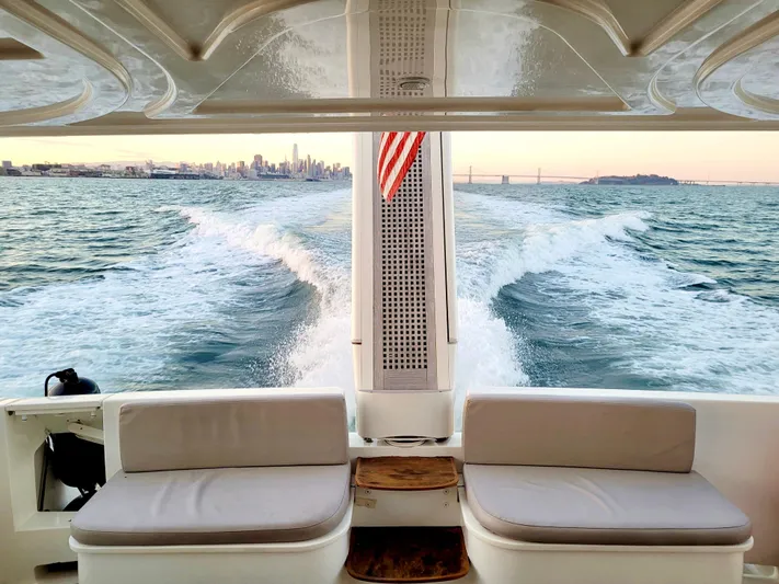 Mi Amore Yacht Photos Pics Ferretti Yachts 550 cruising with city skyline and ocean view, 2006 model.