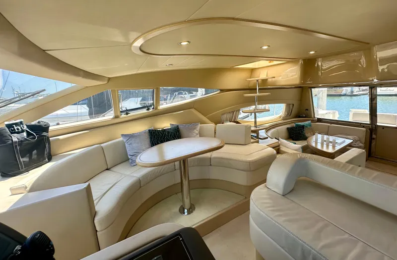 Mi Amore Yacht Photos Pics Luxurious interior of a 2006 Ferretti Yachts 550, featuring elegant seating and modern design.