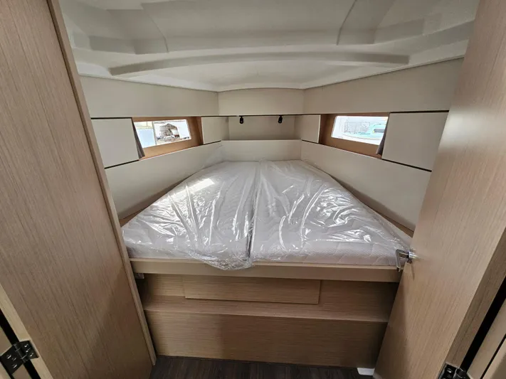  Yacht Photos Pics 2024 Beneteau Oceanis 38.1 cabin with double bed, modern design, and natural light.